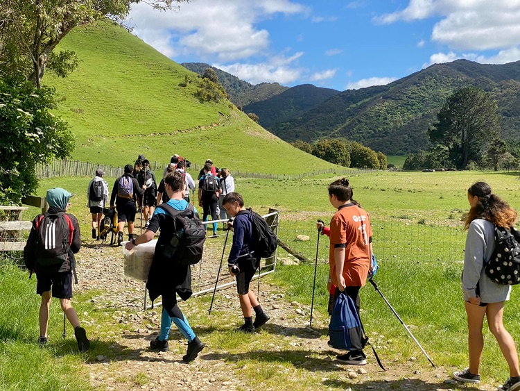 Walking across farmland to the Ruamahanga River