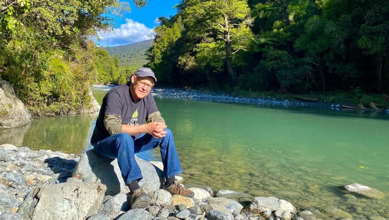 Ruud Kleinpaste takes a moment on a rock beside the Ruamahanga river
