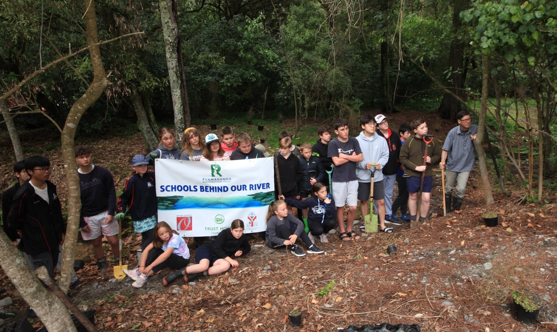 Group of students at a “Schools behind our river” planting day