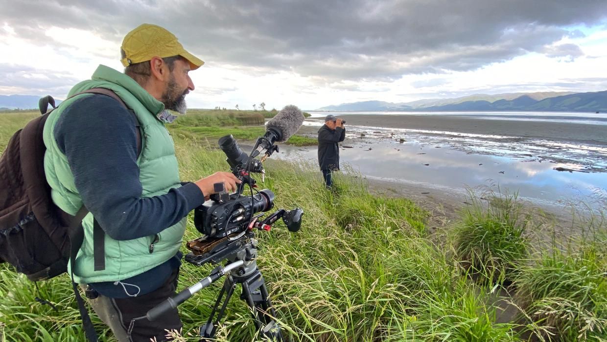 Phil Stebbing filming Ruud Kleinpaste beside Wairarapa Moana