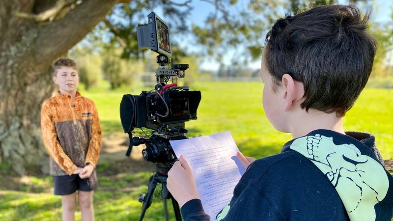 Two students interviewing each other for a video